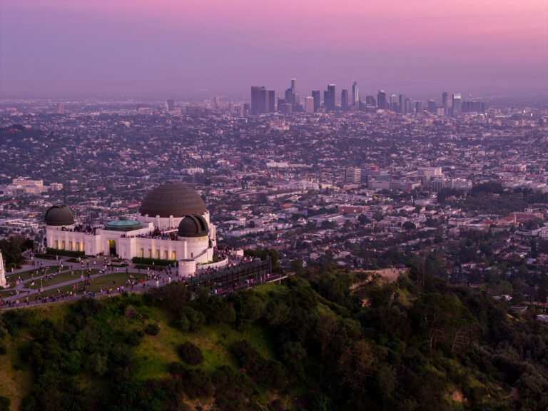 Griffith Observatory and the Los Angeles skyline at dusk, aerial | Matthew Hoyos