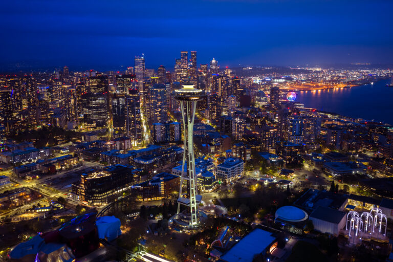 Seattle skyline and Space Needle at night, aerial | Matthew Hoyos