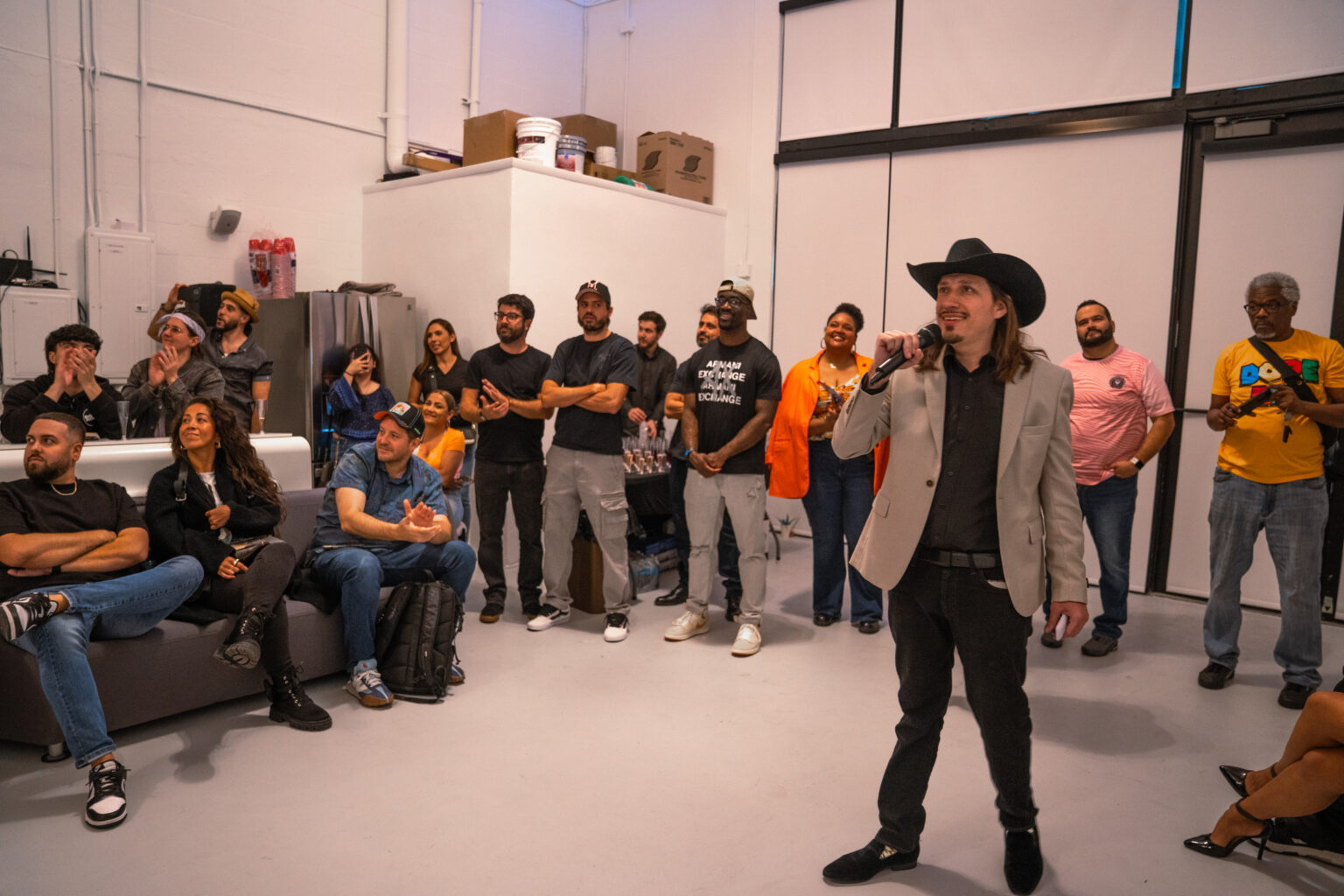 Matthew Hoyos speaking to guests at the Talk of Miami unveiling in Wynwood
