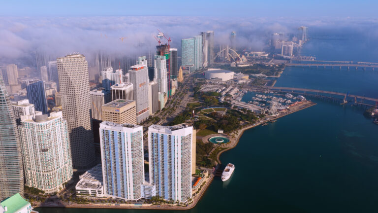 Downtown Miami towers in morning fog, aerial | Matthew Hoyos